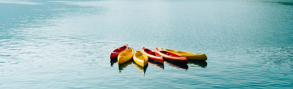 Kayaks floating in the middle of a lake
