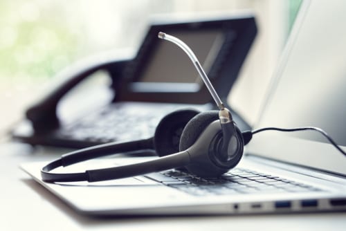 Handheld phone, headset and laptop, to represent VOIP and that aspect of digital transformation